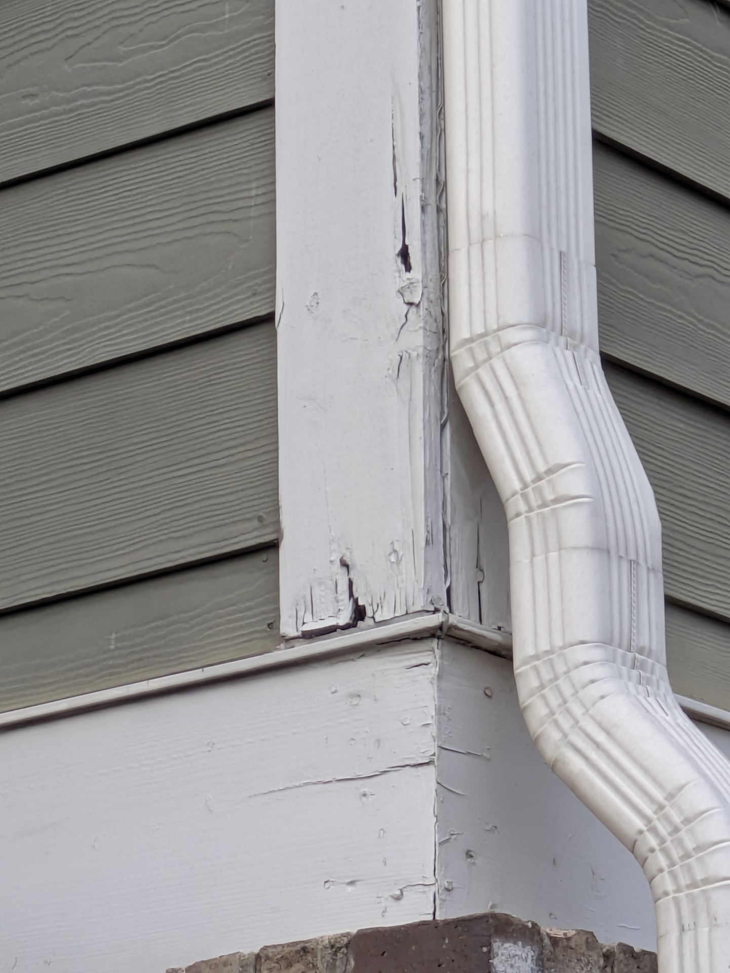 Repairing damaged exterior trim and siding on a historic Athens home